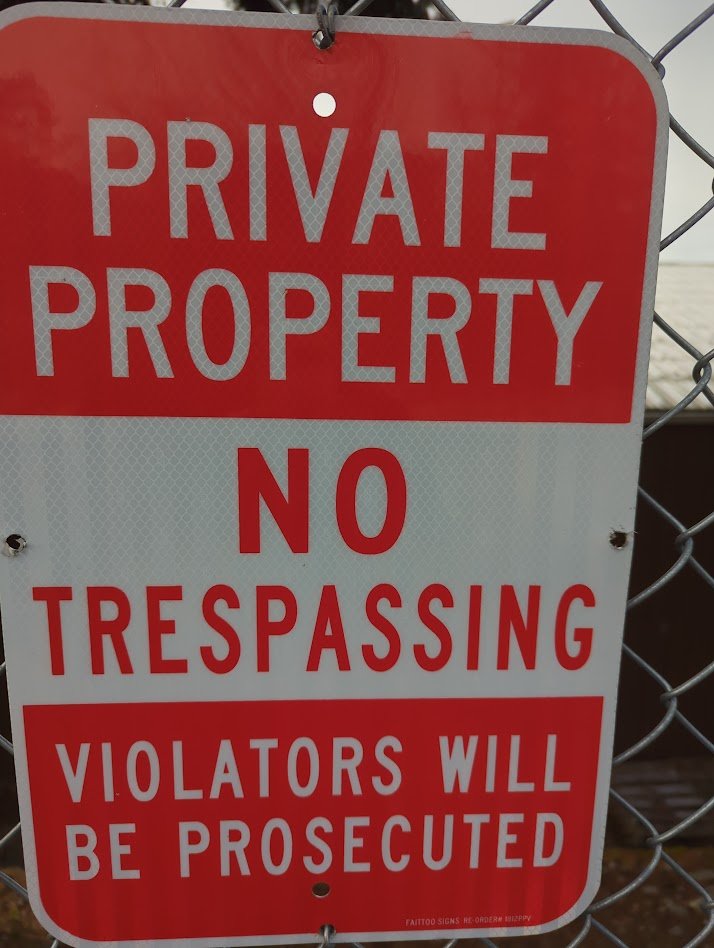 [PRIVATE PROPERTY — NO TRESPASSING]